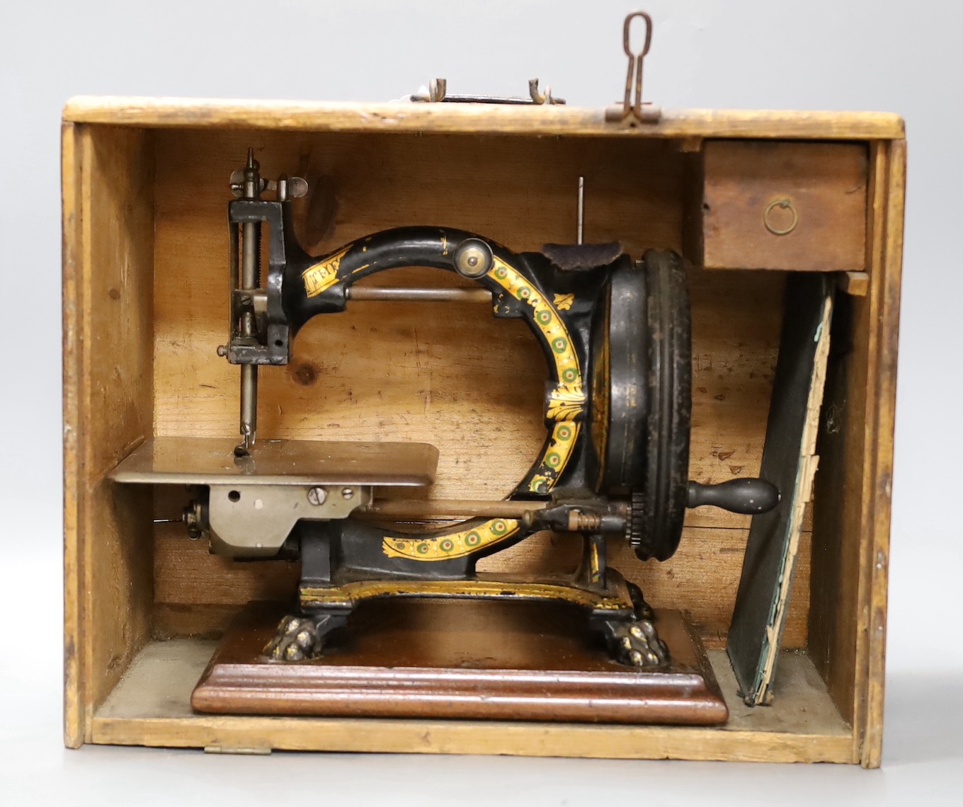 A Smith & Co. The Monarch sewing machine with original case and manual